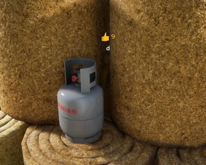 Hay pile with gray cylinder hiding spot screenshot